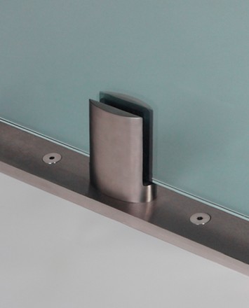 Closeup Studio shot of metal ellipsis Optik POD mounting hardware with glass infill