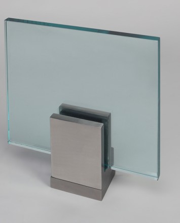 Closeup Studio shot of metal square Optik POD mounting hardware with glass infill
