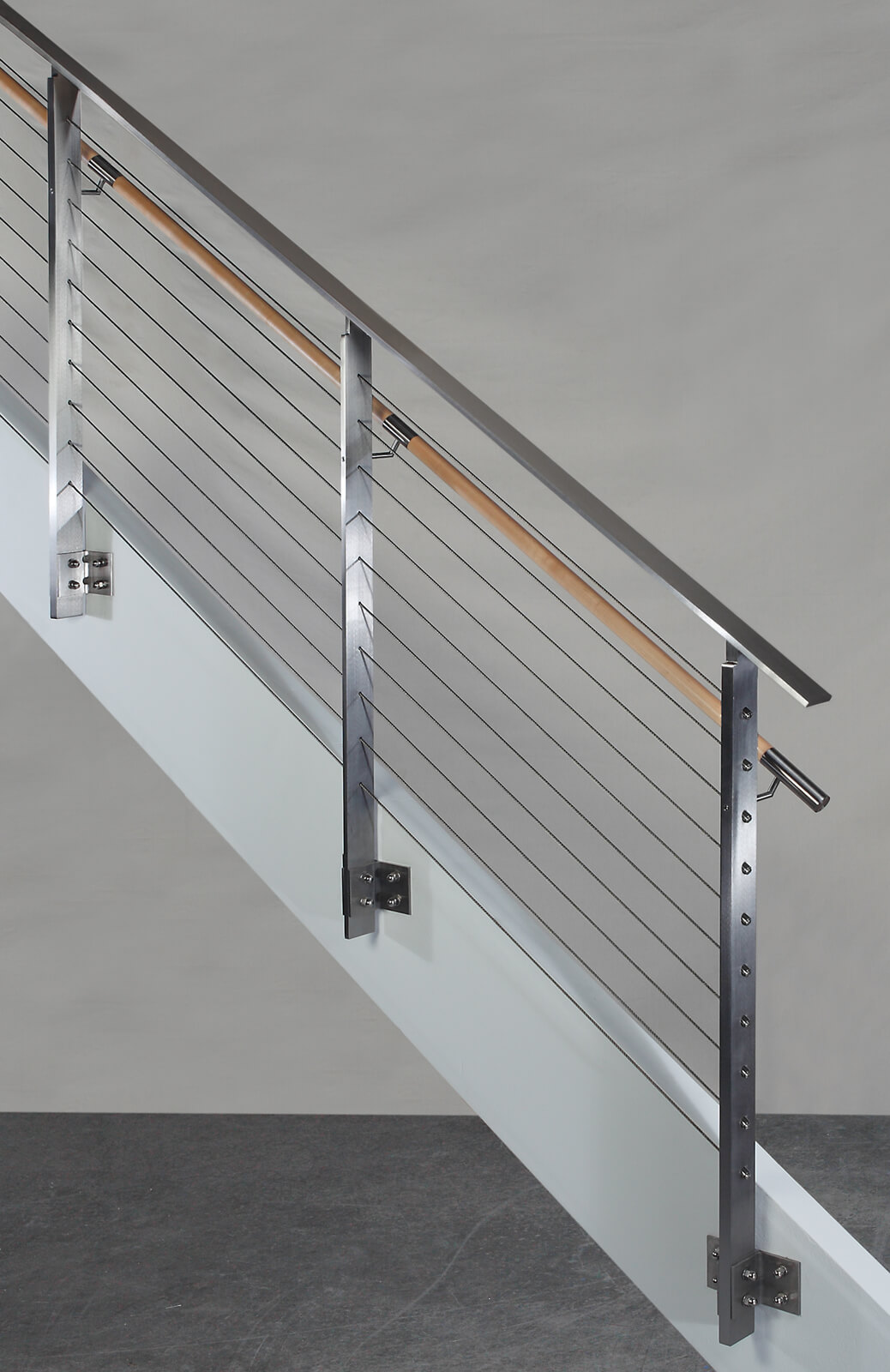 Side view of KOTO, side mounted railing with wood handrail and stainless steel top cap