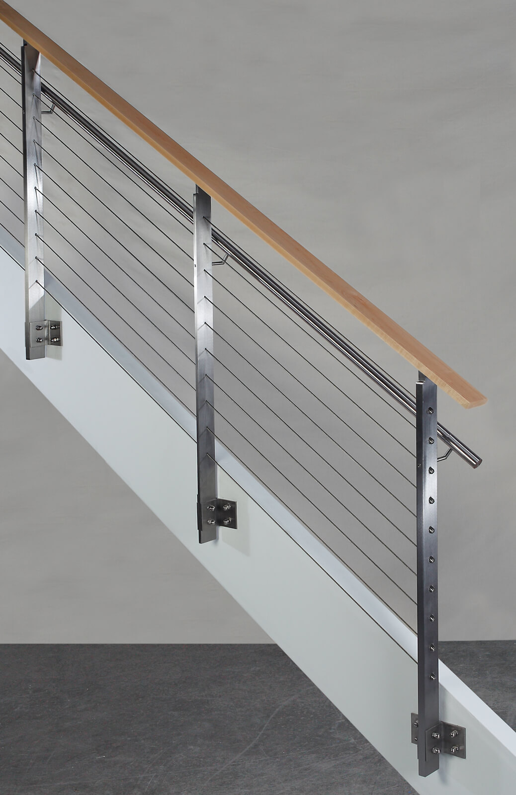 Side view of KOTO, side mounted railing with stainless steel handrail and wood top cap