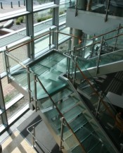 Circum railing with clear glass on a glass stair