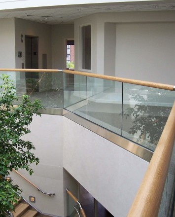 Open lobby are of Office in PA, Optik Shoe with wood cap rail