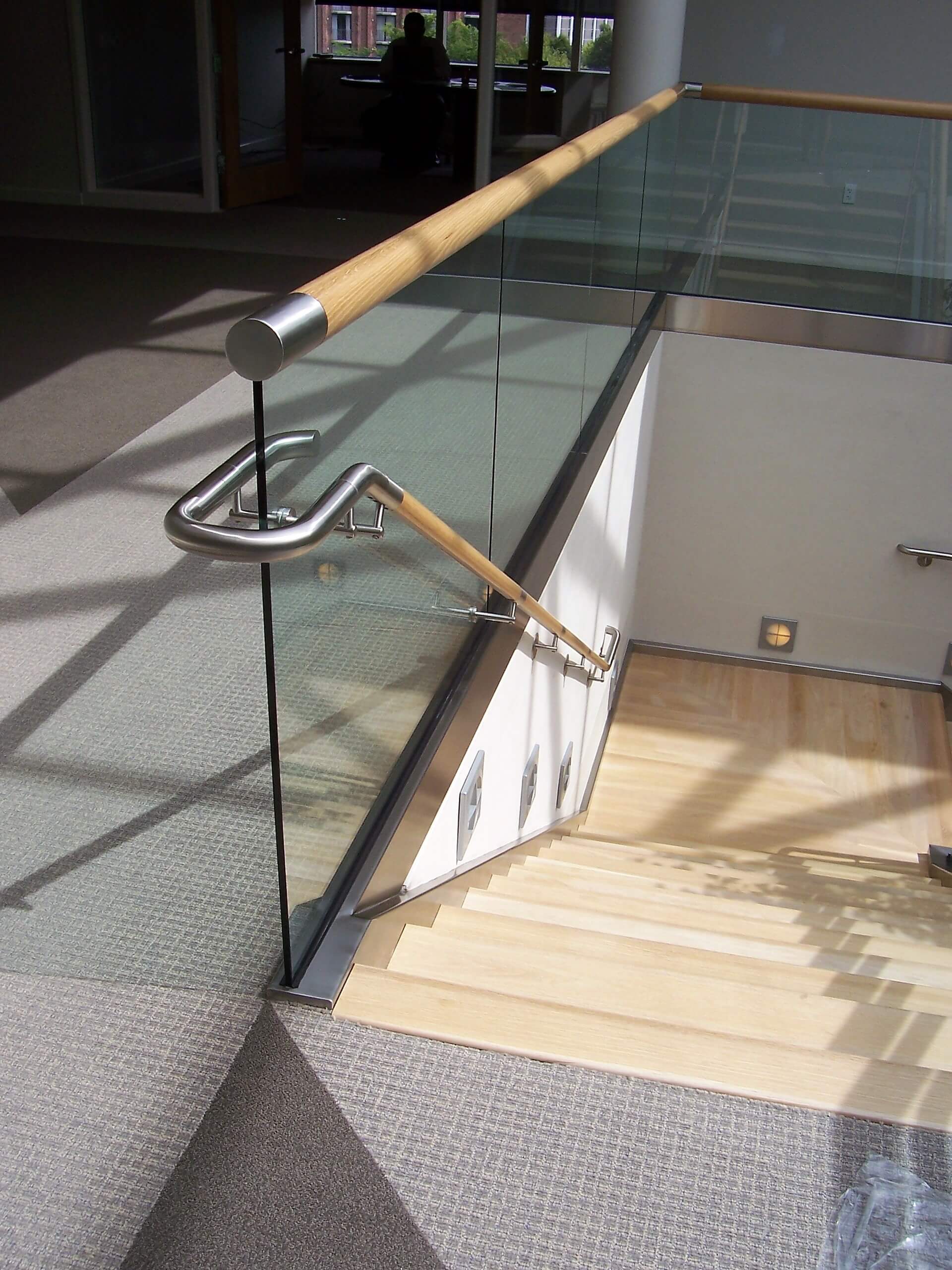 Downward view of Office, PA, Optik Shoe with wood cap staircase