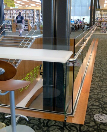 Corner view of Los Gatos Library, Optik Shoe with wood handrails and custom shelf