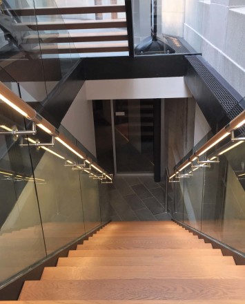 Downward lit view of Mount Pleasant Library, Washington DC, Optik Shoe with wood handrail and LED