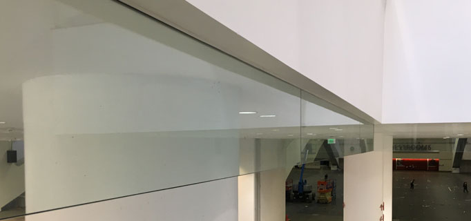 HDI Optik Smoke Baffle Glass Railings provide fire safety curtains at Moscone Center in San Francisco