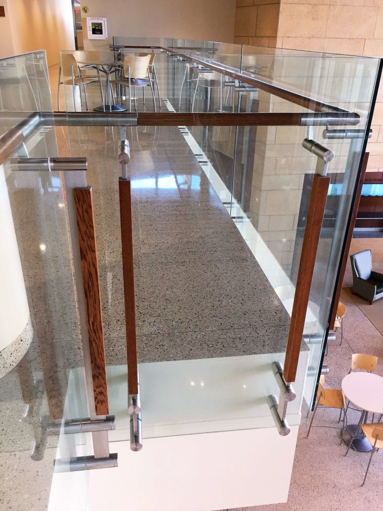 Closeup of handrail with glass infill at UW-Madison School of Nursing
